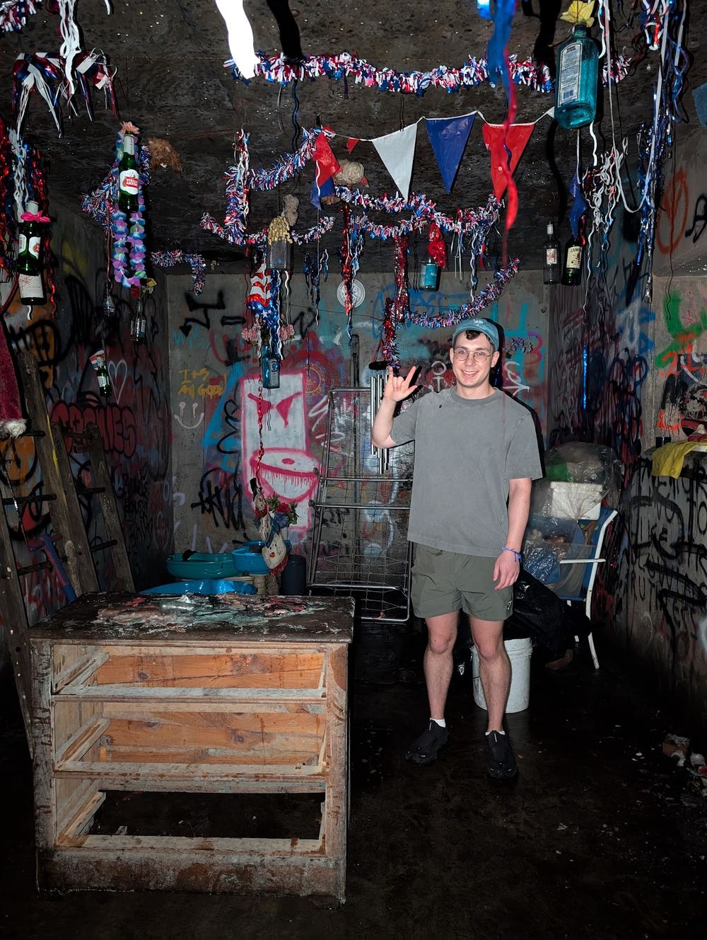 rock on hand sign in a graffiti covered room